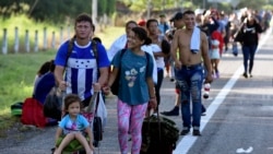 Migrants arrive by foot to Huehuetan, Mexico, Tuesday, Oct. 31, 2023, as they make their way to the U.S. borde. AP